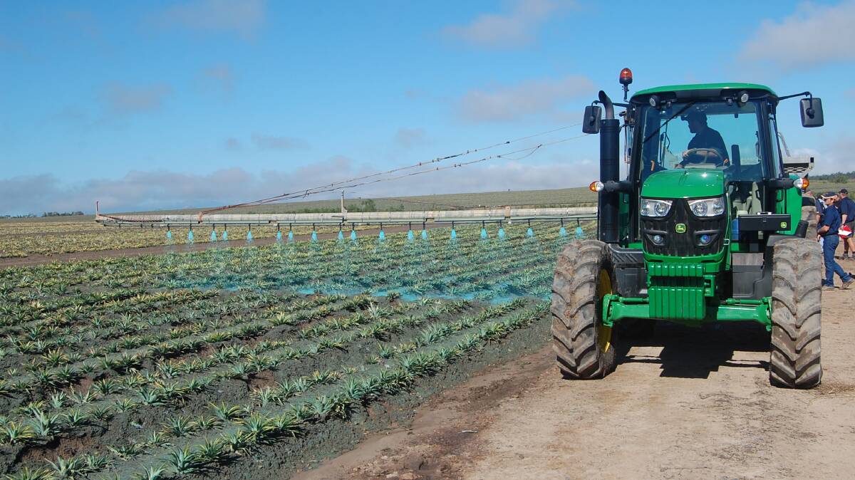 IN ACTION: Vital Bon-Matt Stonewall being applied at 10pc solution to a pineapple crop to help control dust and erosion.