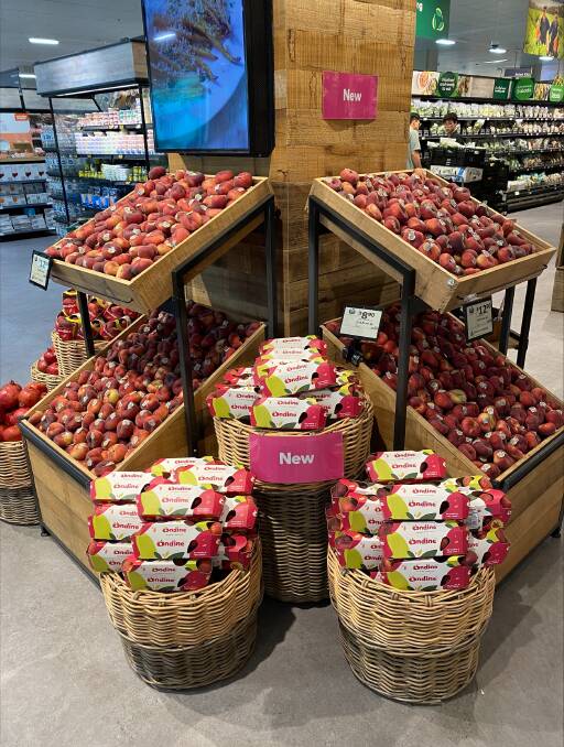 A Woolworths display of Ondine flat peaches. Picture supplied
