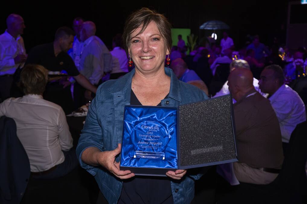 DESERVING: Bronwyn Walsh accepts the Service to Industry award on behalf of recipient, Andrew Pergoliti. 