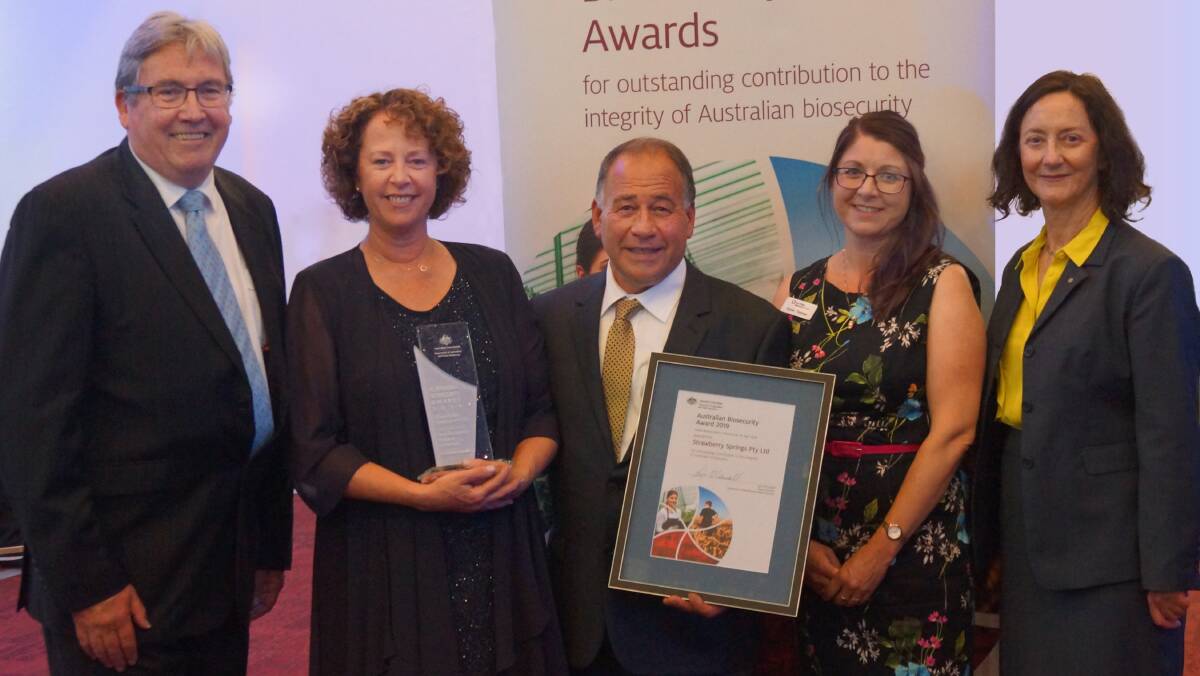 AWARD: Greg Fraser, CEO, Plant Health Australia, Heather and Luciano Corallo, Strawberry Springs, Victoria, with Karen Thomas, Port Phillip and Westernport Catchment Management Authority, who nominated the Corallos for the award, and Lyn O’Connell, deputy secretary, Department of Agriculture and Water Resources. 