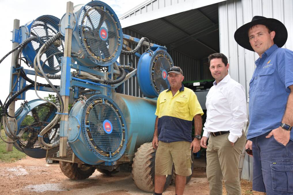 GEAR; Bayer Commercial sales representative, Darren Alexander (centre) with Shaun and David Arnold, discussing the workings of the family’s Interlink powerprop 900 citrus sprayer on their Riverland property.