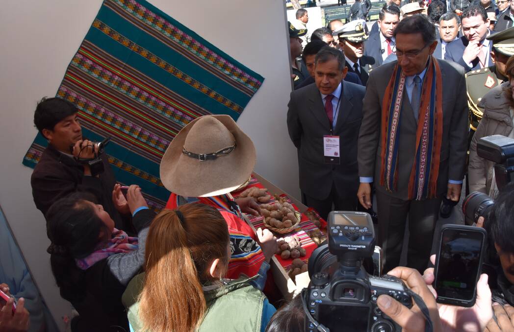 FACE TO FACE: Peruvian president, Martin Vizcarra meets a potato grower with his display of native varieties. 