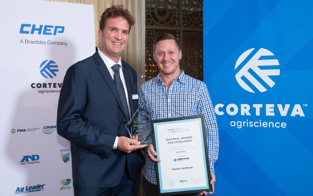 AWARDED: Corteva Agriscience marketing manager, Nick Koch and Daniel Hoffmann, receiving his Young Grower of the Year Award. 