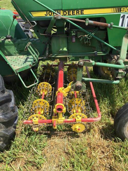 CLOSE: Basket weeder being demonstrated at Hudson Vallee Farm Hub, USA. A basket weeder weeds up close to normally young high value crops; for this reason, the baskets are mounted under the engine of the tractor as shown in this image.