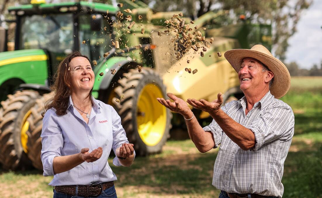 Coles Group general manager of corporate and Indigenous affairs Sally Fielke catches up with Dane Martin, general manager of Endhill Pty Ltd which used a Coles Nurture Fund grant in 2018 to buy machinery to harvest lucerne in the paddock and convert it to pellets for cattle. Picture supplied