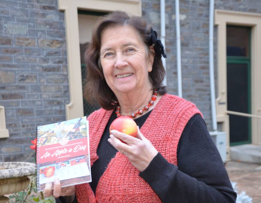 TOP TASTE: SACWA state creative arts officer Rosalie Smith, Maitland, with the newly-launched apple-focused cookbook. 