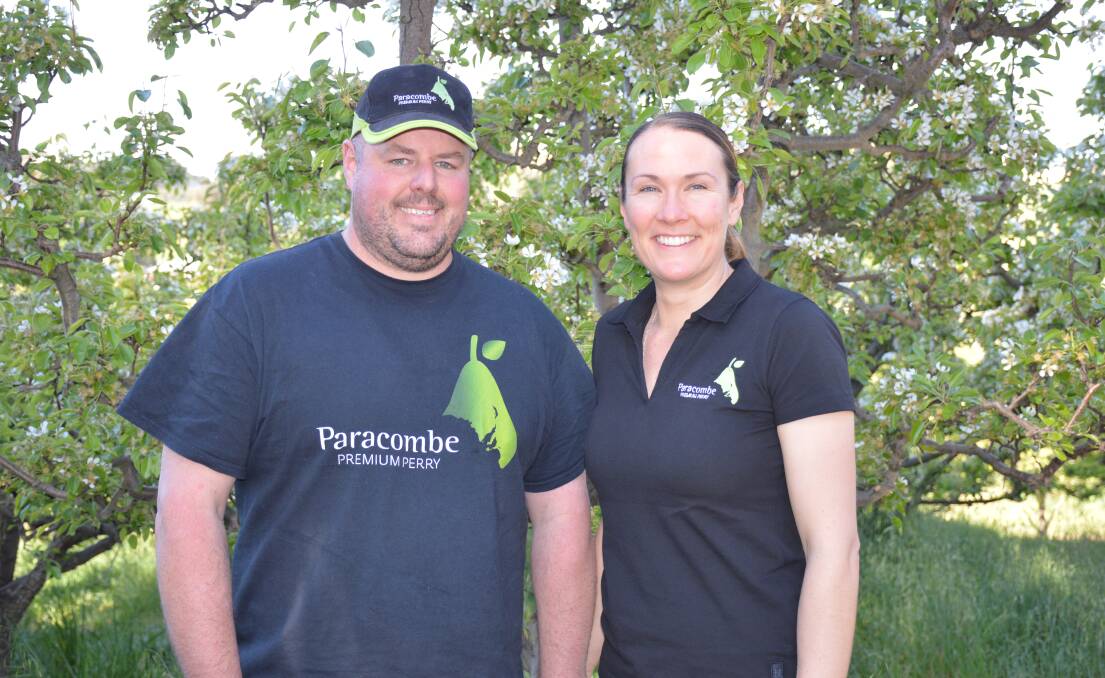 Paracombe Premium Perry founders and Chamberlain Orchards operators Damian and Amelia McArdle in their organic pear orchard in the Adelaide Hills. Picture by Elizabeth Anderson