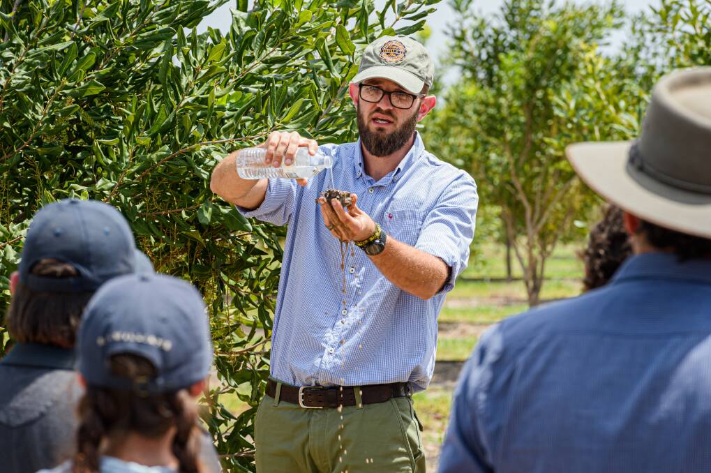 WORKING TOGETHER: South African tree-water researcher Dr Theunis Smit demonstrates soil water holding capacity at a tree-water relations workshop. 