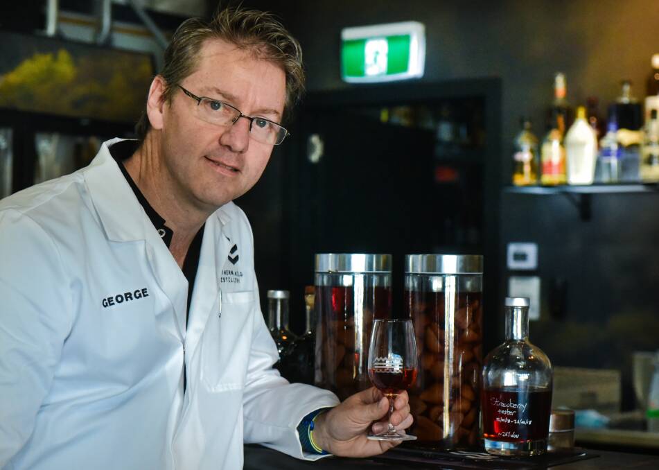 CHEERS: Devonport distiller George Burgess is able to use fruit which can't be sold because of fruit fly in his gin liqueurs. Picture: Neil Richardson.