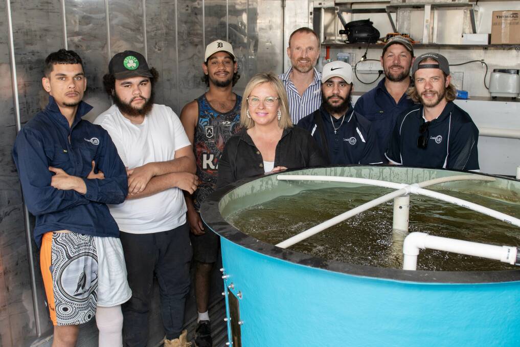 Joh Leader and young people from LeaderLife with the aquaponics garden. Picture by Belinda Soole