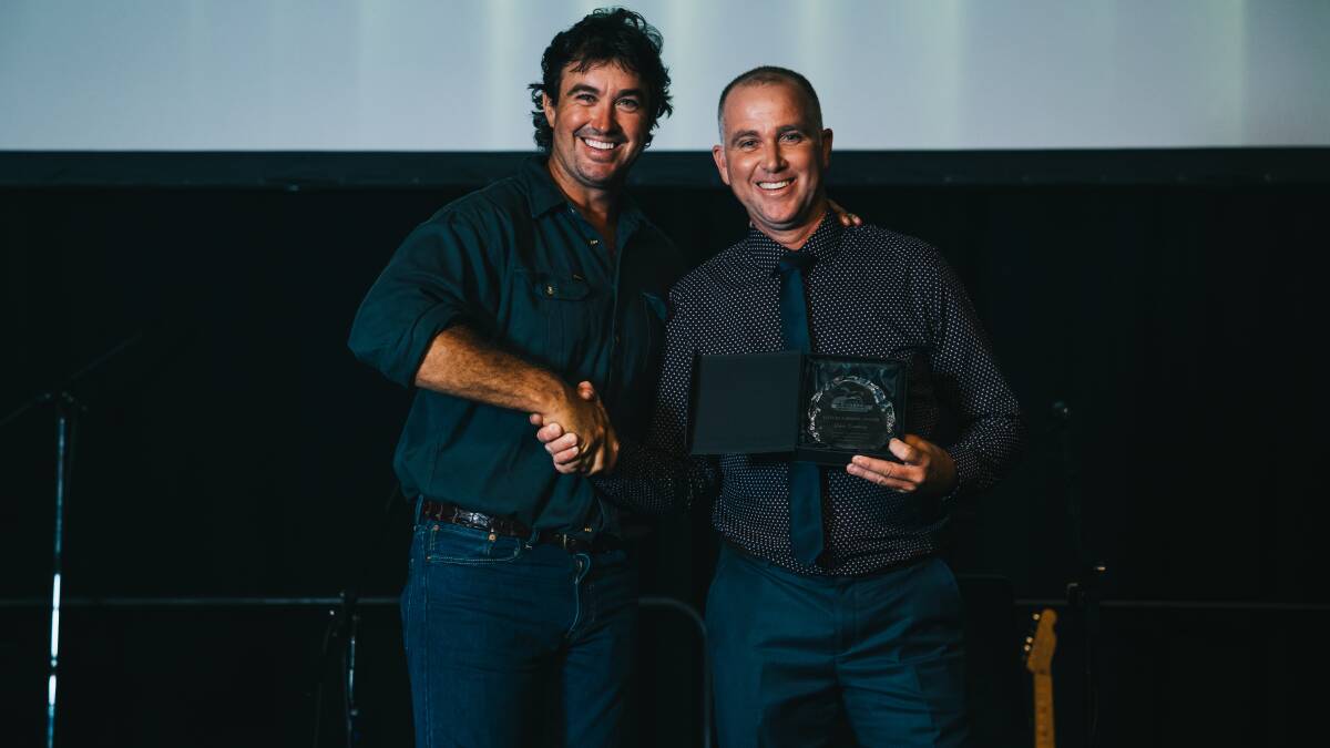AWARDED: Crocodile wrangler Matt Wright presents Gavin Devaney with his award. 