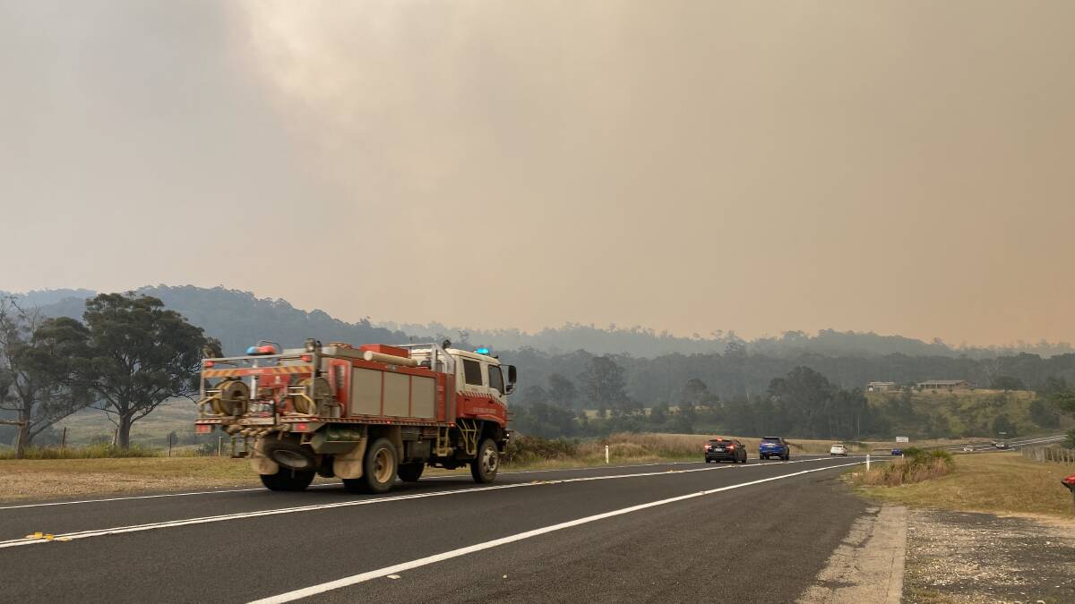 Firefighters rush to the Currowan fire.
