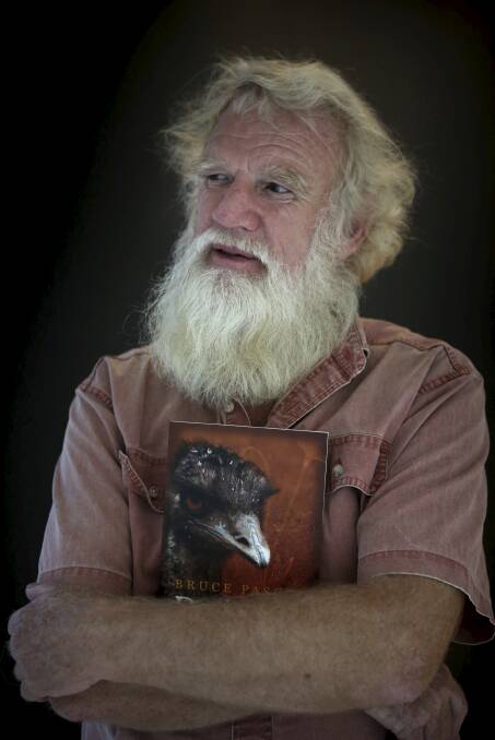 HISTORY RE-THINK: Author Bruce Pascoe holding a copy of his book, Dark Emu – Black Seeds: Agriculture or Accident? Photo: James Alcock