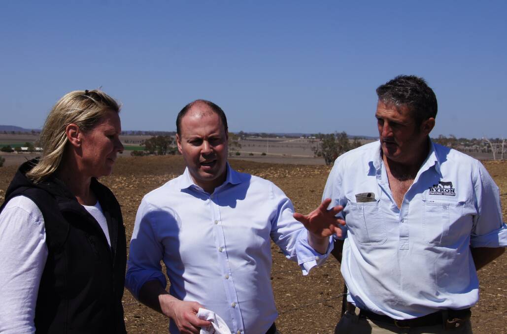 REALITY: Treasurer Josh Frydenberg with Sandy and Ben Swan at their property near Inverell, in northern NSW.