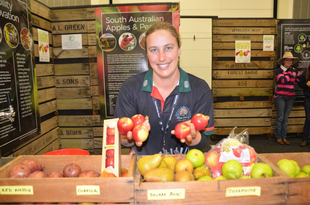 QUALITY: Lenswood apple grower Mel Ware at the SA Apple and Pears Growers Association stand at the Royal Adelaide Show. 