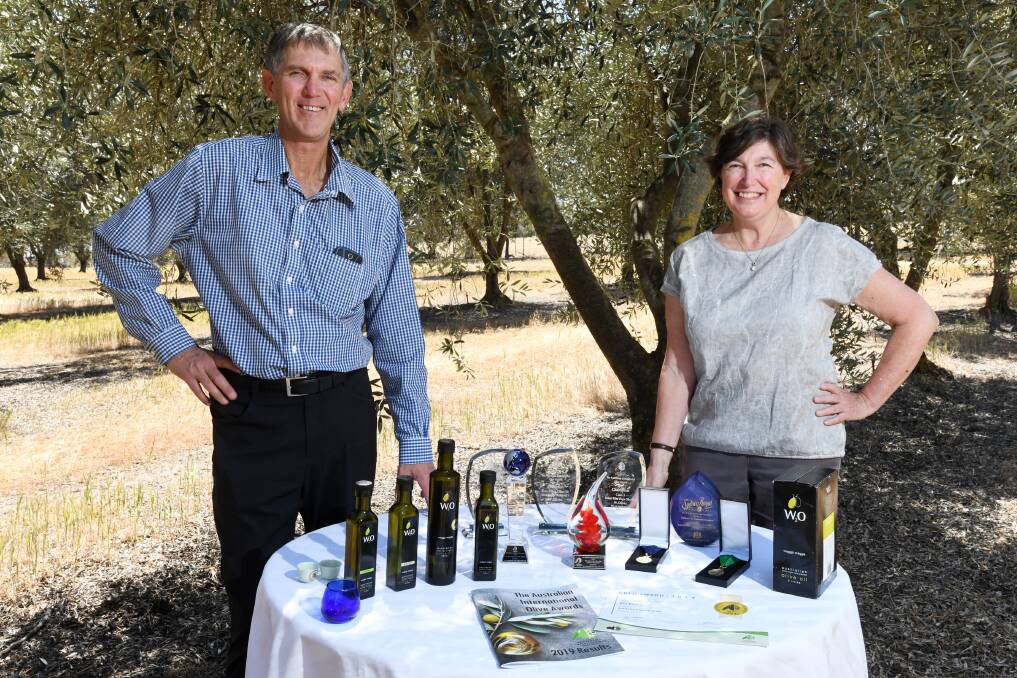 PASSION: W2 Olives' owners Geoff and Jenny Masters at their olive grove after securing multiple gongs at the 2019 Australian Olive Association's conference last Friday. Picture: The Daily Advertiser