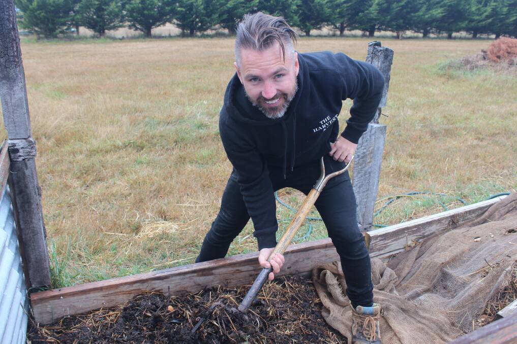 ORGANIC RECYLCING: Anthony Cribbes turns his compost pile of food scraps from Buninyong businesses. 