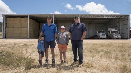 Grant Ross, his son Bradley and grandchildren. The shed features a girder truss for easy access of large machinery 