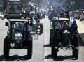Farmers drive tractors through central Buenos Aires to to protest government policies and high taxes
