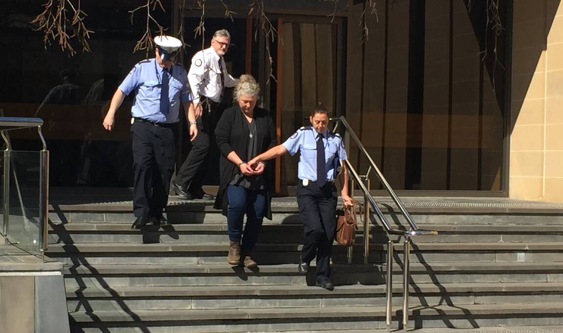 GONE: Letetia Anne Ware is escorted from the Hobart Supreme Court. Picture: Emily Jarvie 