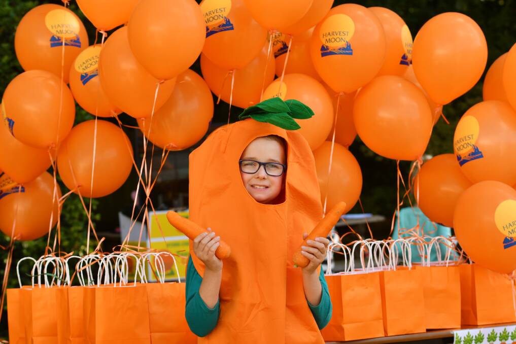 CARROTASTIC: One of the Harvest Moon Carrot Festival participants embraces the vegetable. 